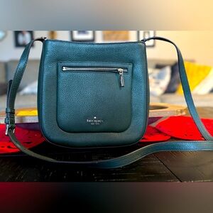 Kate Spade messenger crossbody bag in a rich hunter green.